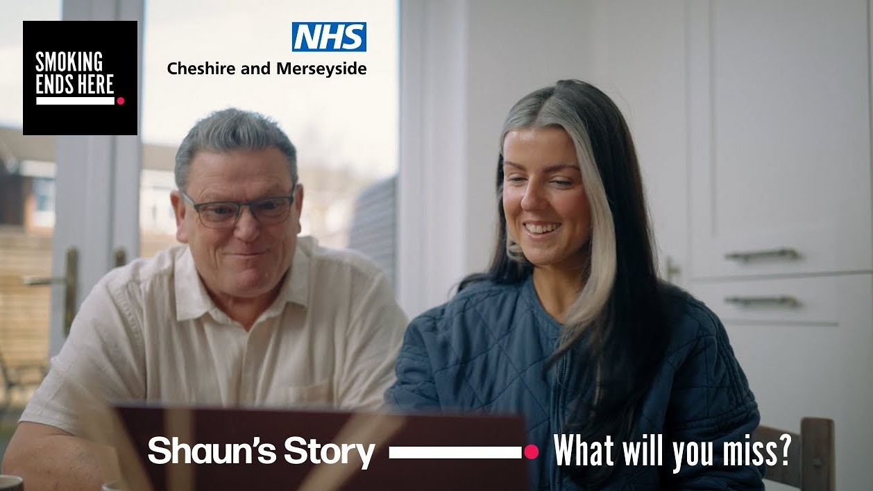 A man and woman sit smiling at a laptop. The "Smoking Ends Here" logo and "NHS Cheshire and Merseyside" are at the top. Text reads "Shaun's Story – What will you miss?"