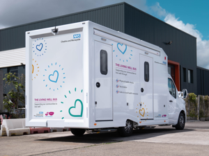 The Living Well Bus, large white van
